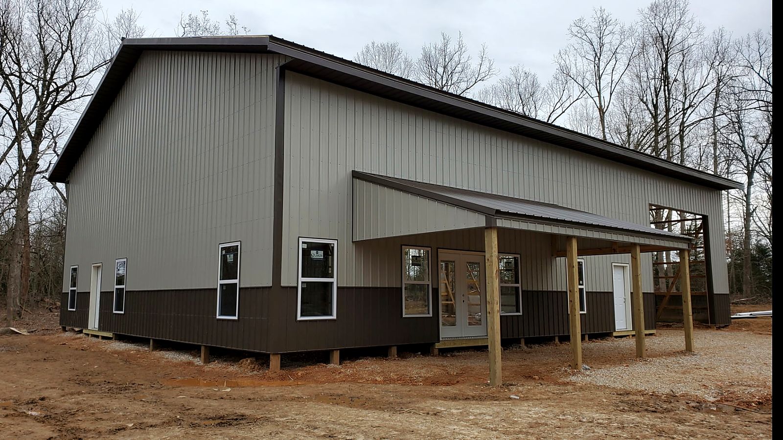 Nichols Construction completed barndominium with covered front porch
