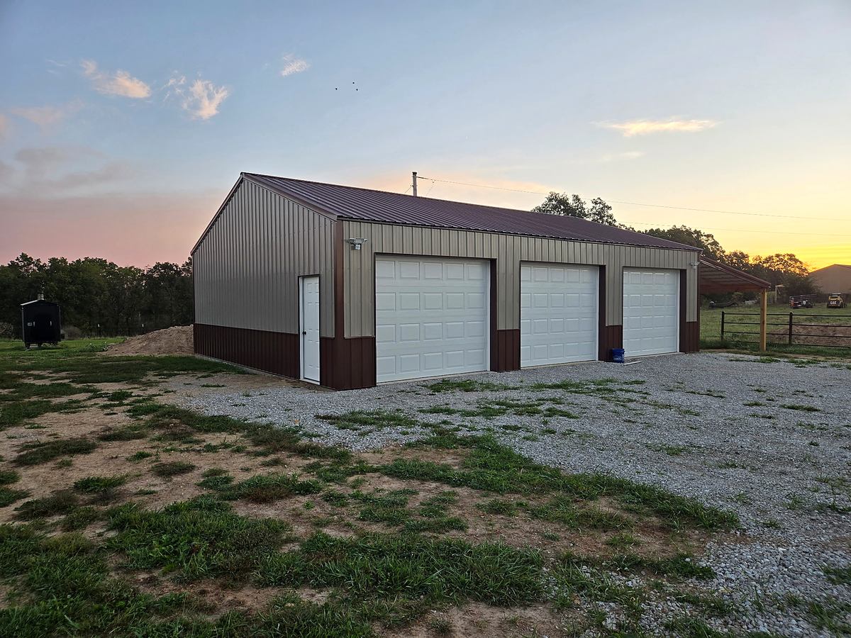 Completed three-bay pole barn at sunset