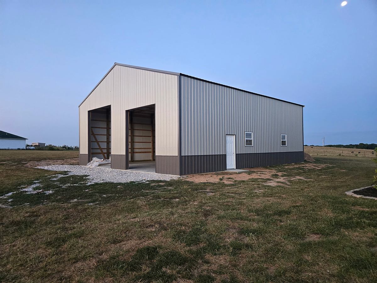 White and charcoal pole barn exterior